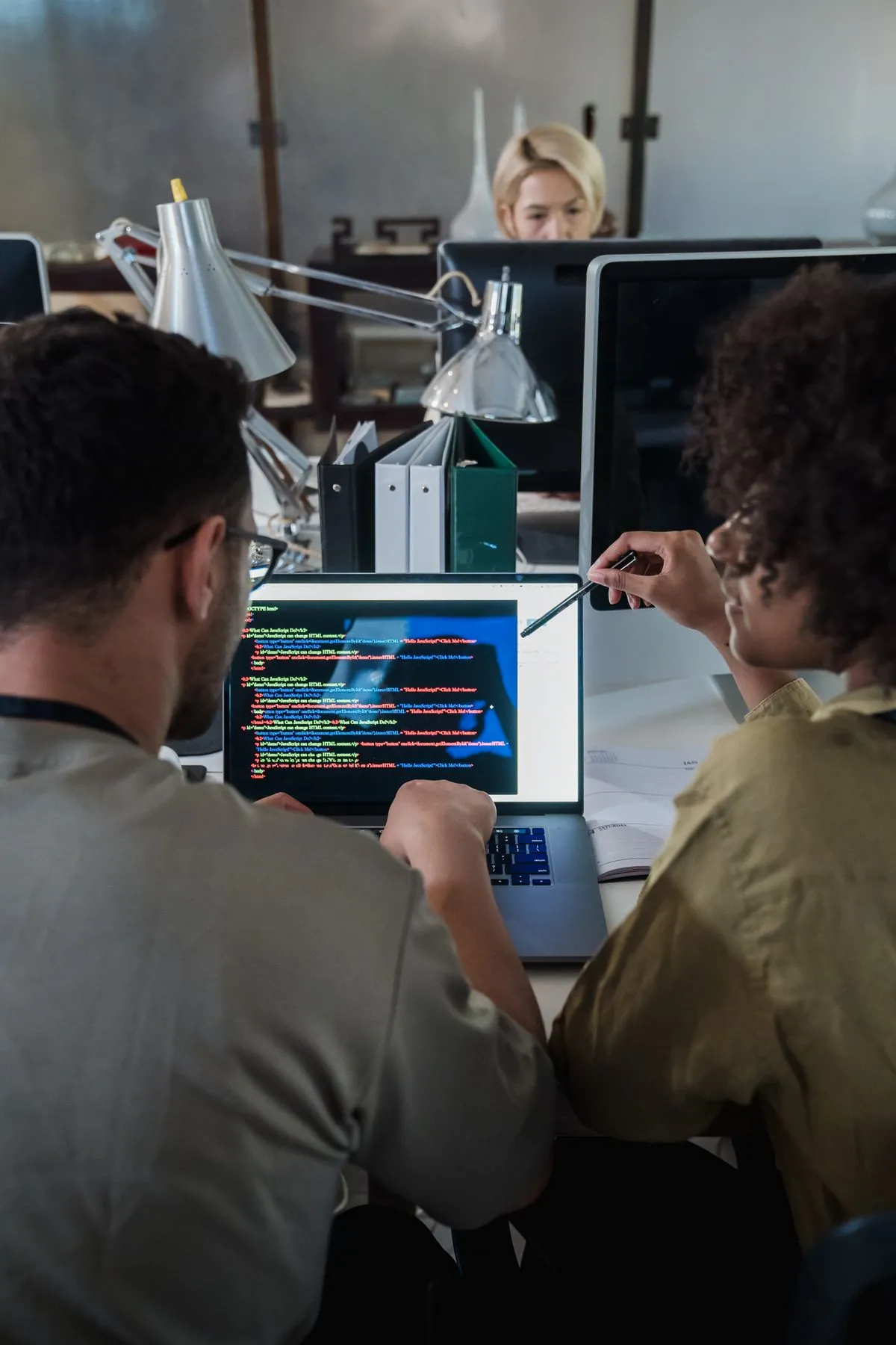 Programmer coding on laptop