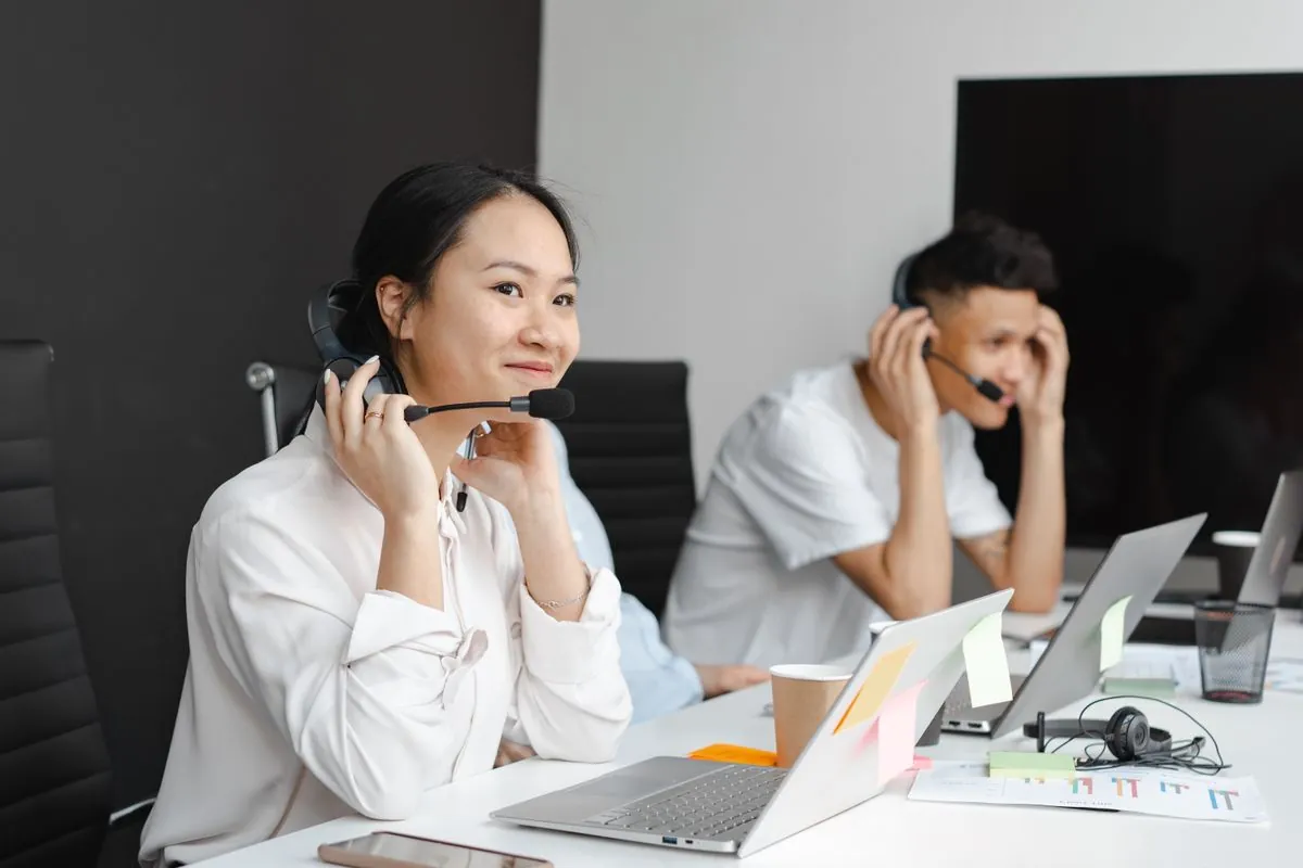 customer support agent at a desk with headset